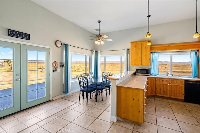 kitchen with french doors, tile counters, dishwasher, kitchen peninsula, and ceiling fan