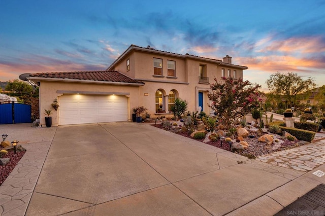 mediterranean / spanish-style house featuring a garage