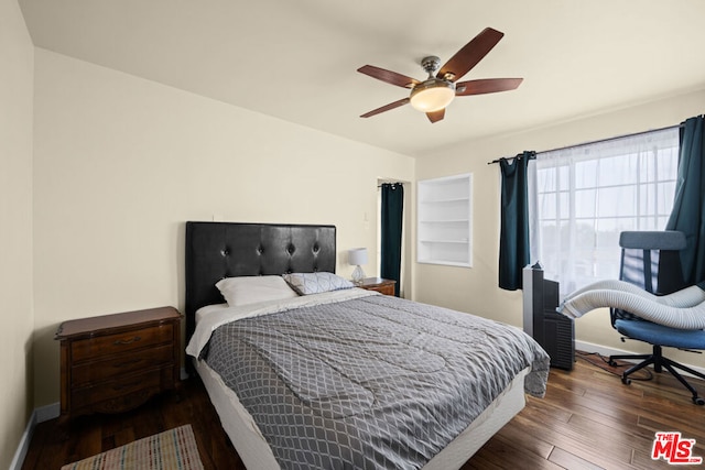 bedroom with ceiling fan and dark hardwood / wood-style flooring