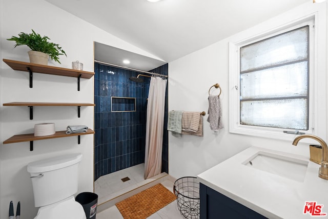 bathroom featuring toilet, vanity, vaulted ceiling, and walk in shower