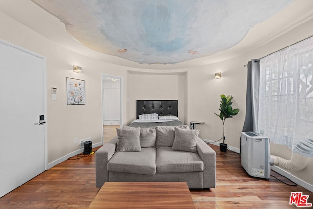 bedroom with hardwood / wood-style floors