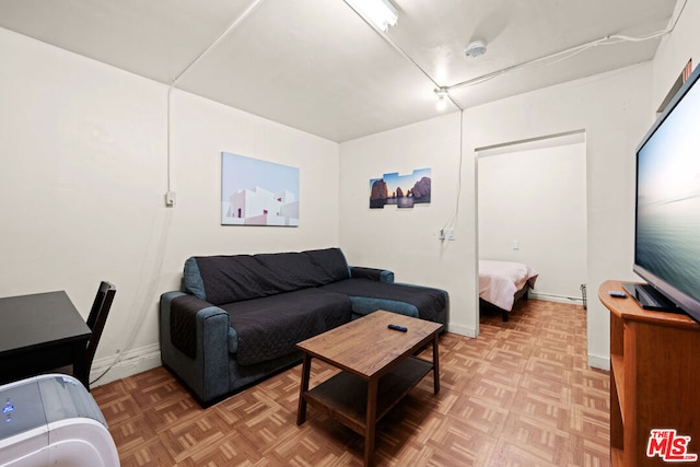 living room featuring parquet flooring