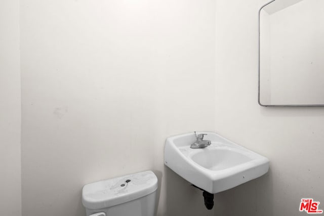 bathroom with sink and toilet