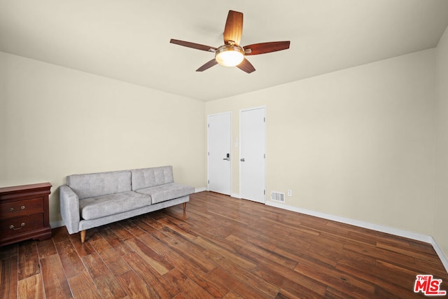 unfurnished room with ceiling fan and dark hardwood / wood-style flooring