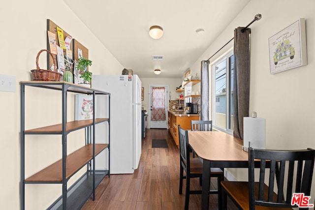 dining space featuring hardwood / wood-style floors