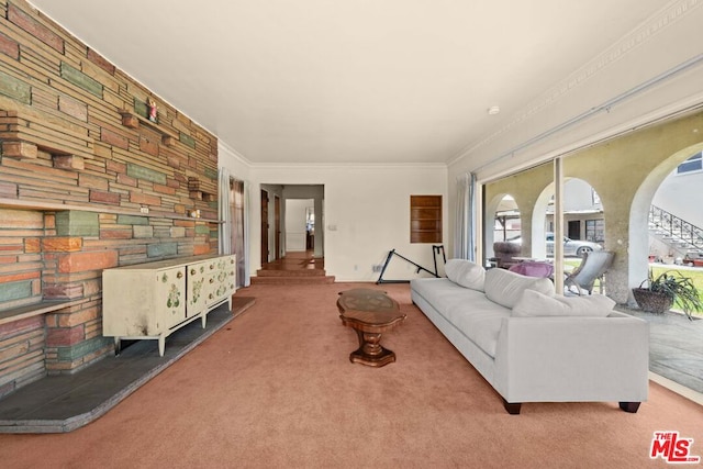 carpeted living room featuring ornamental molding