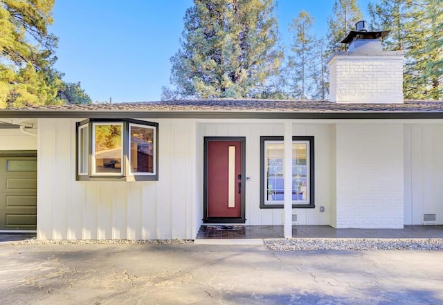 entrance to property featuring a garage