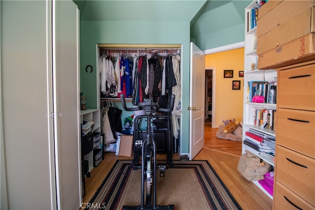 exercise room with hardwood / wood-style floors