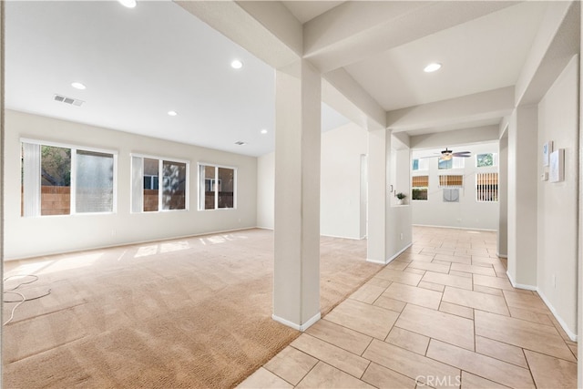 interior space featuring ceiling fan and light colored carpet