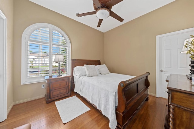 bedroom with ceiling fan and hardwood / wood-style floors