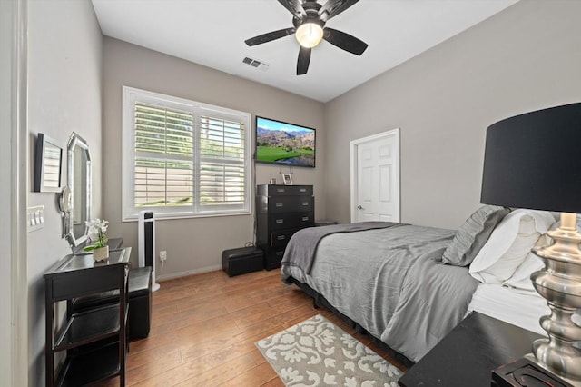 bedroom featuring ceiling fan and light hardwood / wood-style flooring