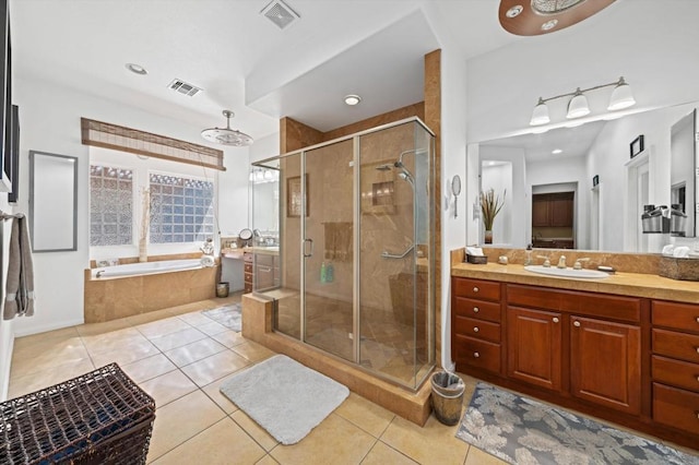 bathroom with separate shower and tub, tile patterned floors, and vanity