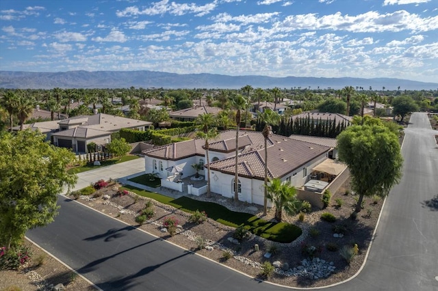 drone / aerial view featuring a mountain view