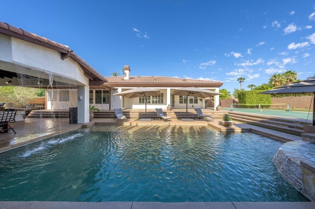 view of pool featuring a patio and pool water feature