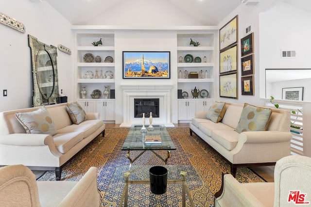 living room featuring built in shelves, high vaulted ceiling, and wood-type flooring