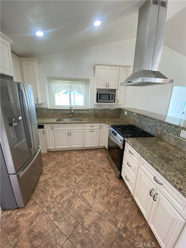 kitchen featuring island exhaust hood, stainless steel appliances, and white cabinetry