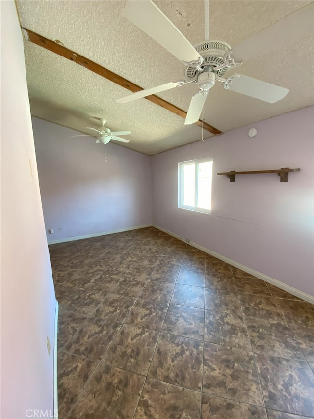 spare room featuring a textured ceiling and ceiling fan