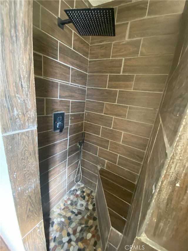 bathroom with a tile shower