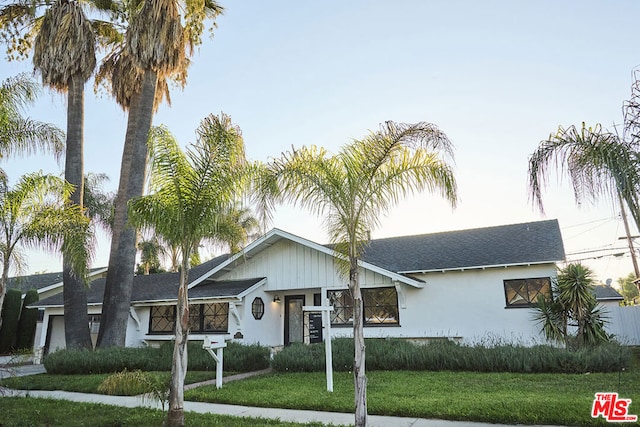 view of front of property with a front lawn