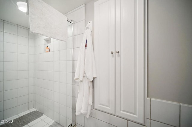 bathroom with tiled shower