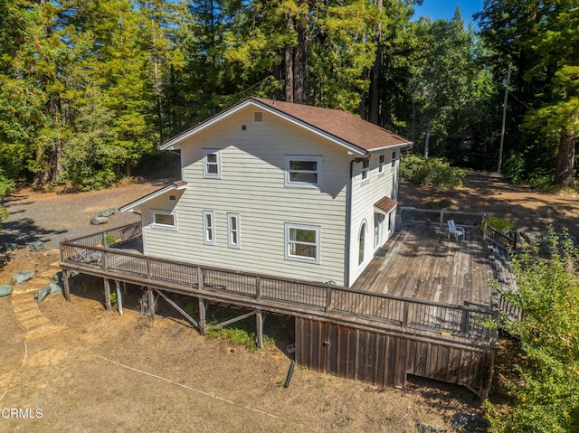 back of house with a wooden deck