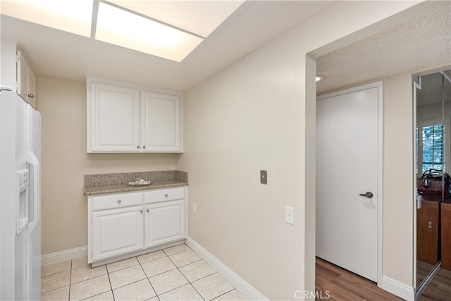 washroom with light tile patterned floors