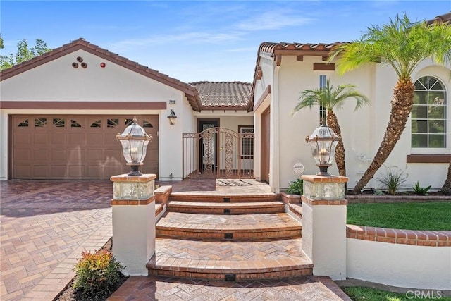 mediterranean / spanish home featuring a garage