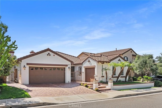 mediterranean / spanish house featuring a garage