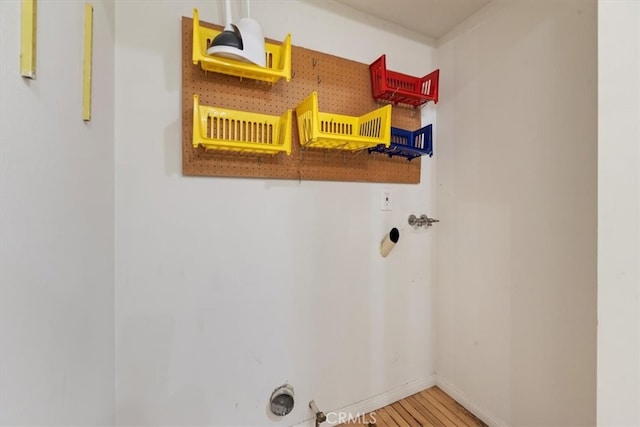 laundry area featuring washer hookup and wood-type flooring