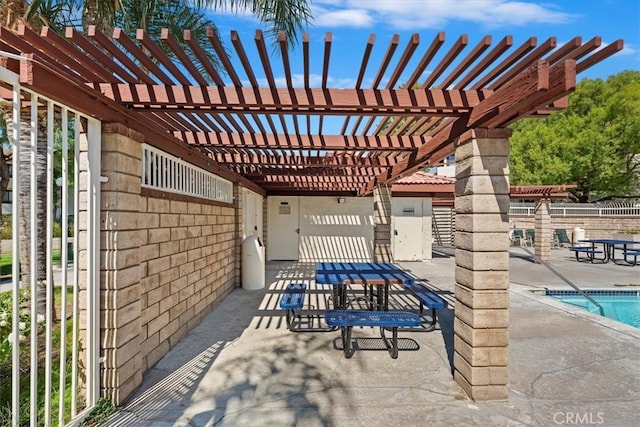 view of patio / terrace featuring a pergola and a community pool