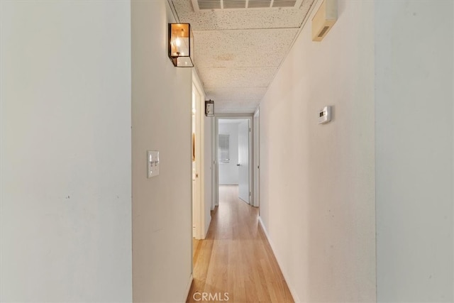 corridor featuring light hardwood / wood-style flooring