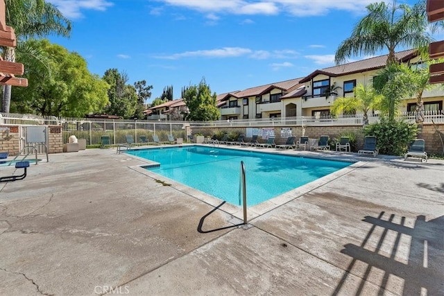 view of swimming pool featuring a patio area