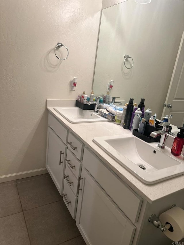 bathroom with tile patterned floors and vanity