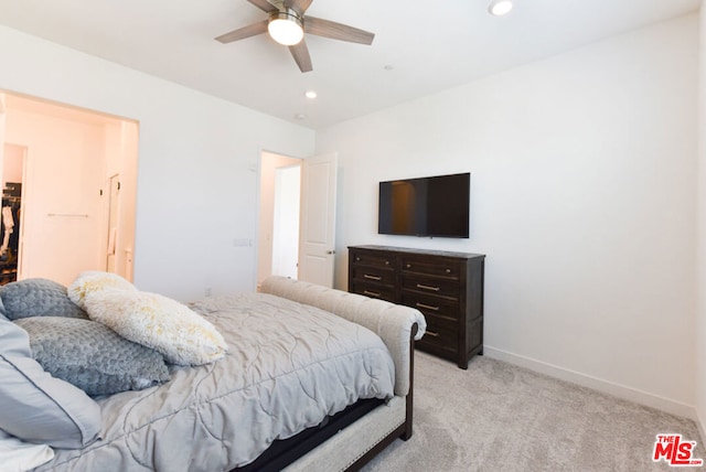 bedroom featuring light carpet and ceiling fan