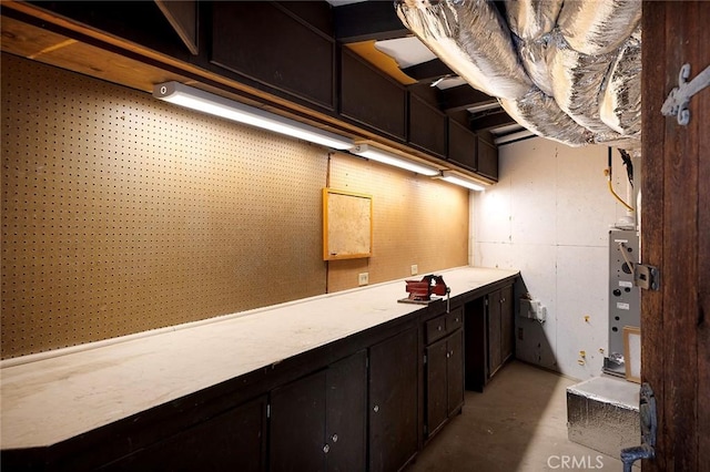 bathroom with a workshop area and concrete flooring