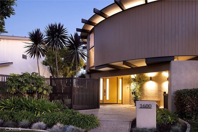 view of exterior entry at dusk