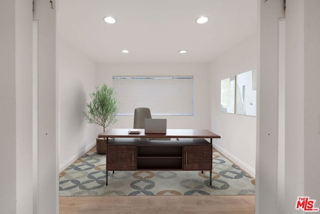 office area with light hardwood / wood-style floors