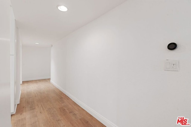 hallway with light wood-type flooring