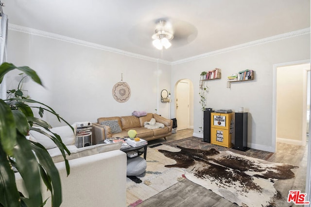 living room with crown molding, ceiling fan, and hardwood / wood-style flooring