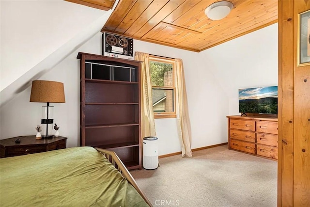 bedroom with lofted ceiling, wood ceiling, and carpet flooring