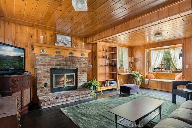 living room featuring hardwood / wood-style flooring, built in shelves, wood ceiling, and a fireplace