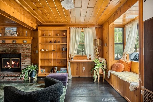 living area featuring dark wood-type flooring, wood ceiling, wood walls, and a healthy amount of sunlight