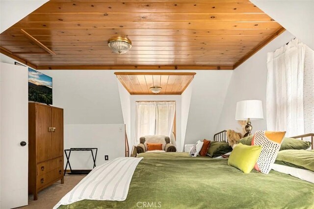 carpeted bedroom with wooden ceiling