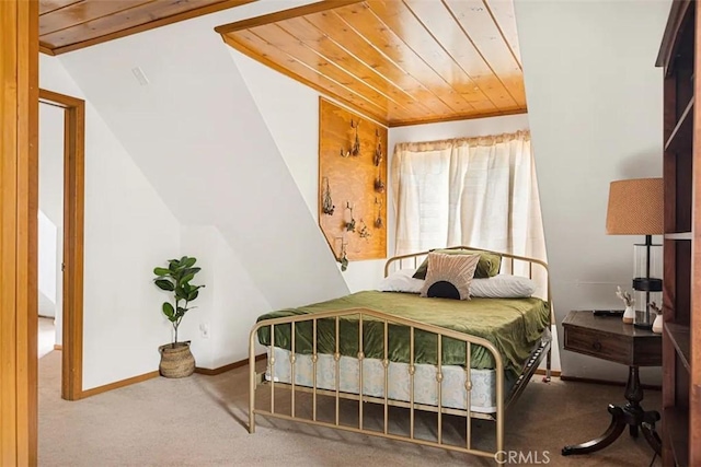 carpeted bedroom with lofted ceiling and wood ceiling