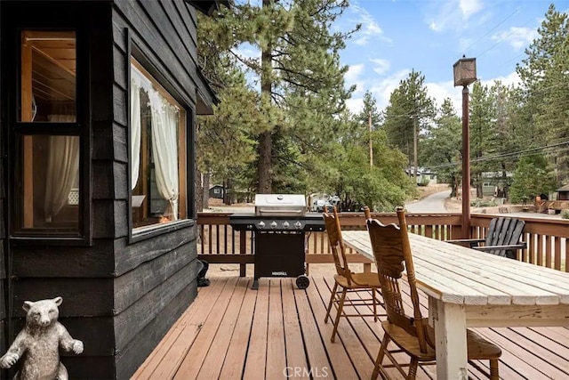 wooden terrace featuring area for grilling