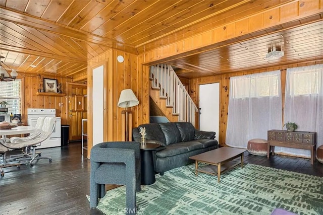 living room with dark wood-type flooring, wood ceiling, and wooden walls