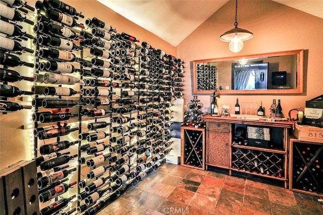 wine room featuring lofted ceiling