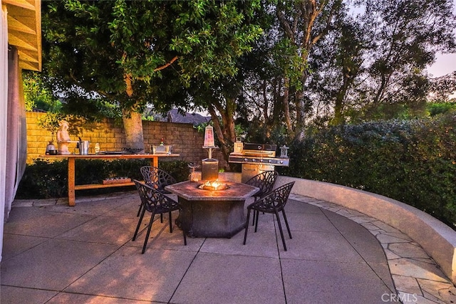 view of patio terrace at dusk