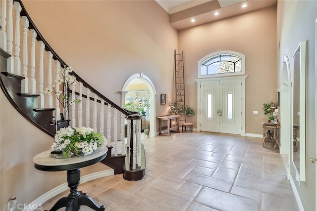 entryway with a high ceiling