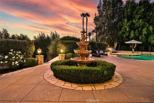 exterior space featuring a swimming pool and a patio area